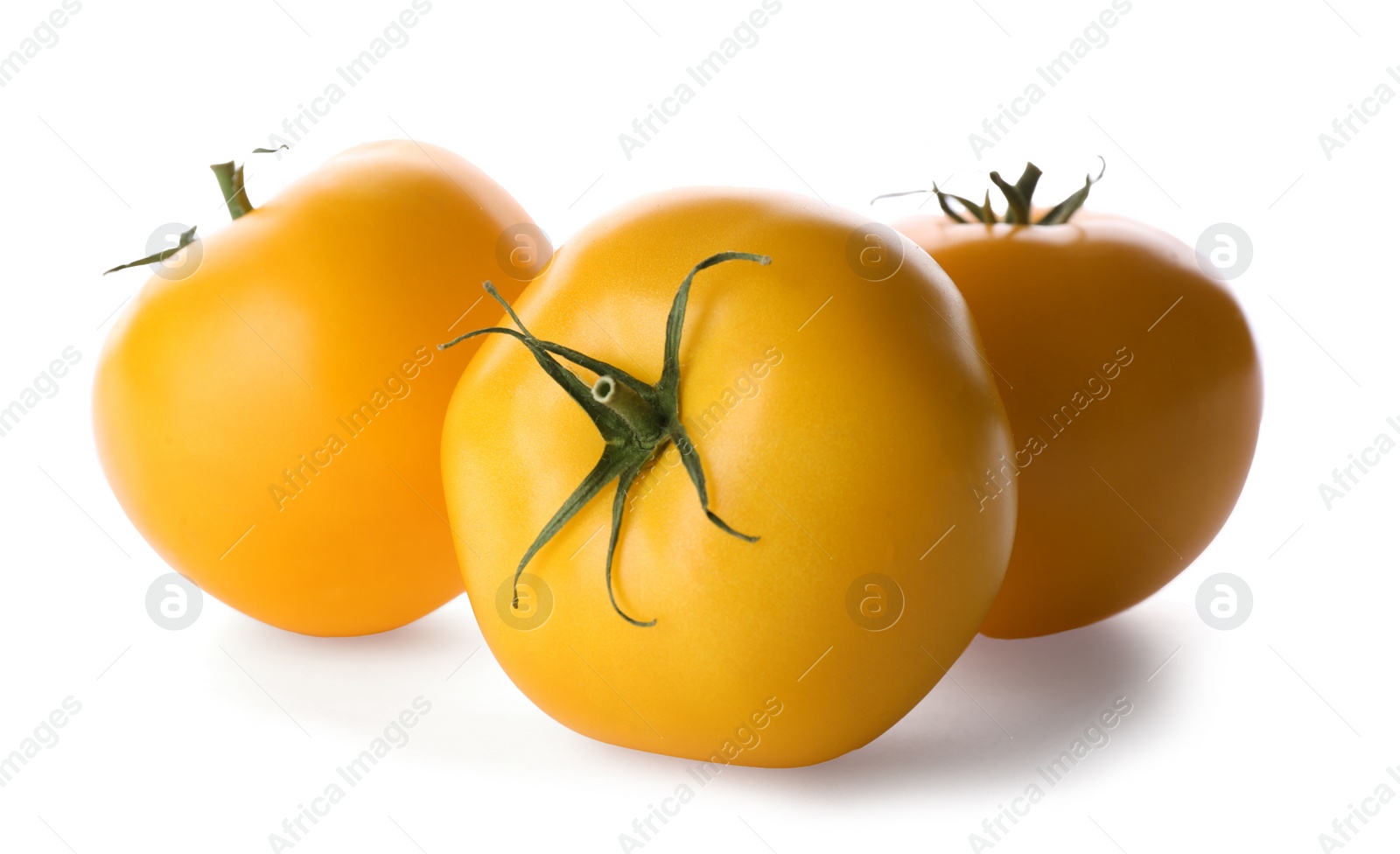 Photo of Delicious ripe yellow tomatoes isolated on white