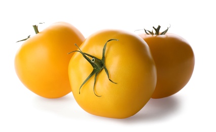 Photo of Delicious ripe yellow tomatoes isolated on white