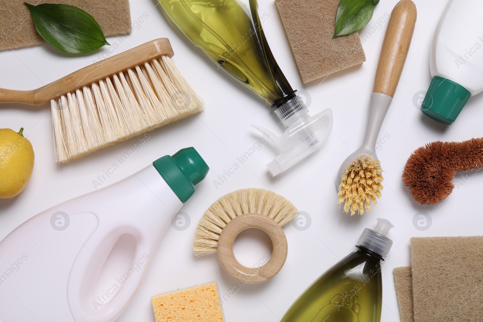 Photo of Flat lay composition with different cleaning supplies on white background