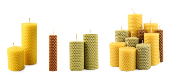 Set of beeswax candles on white background