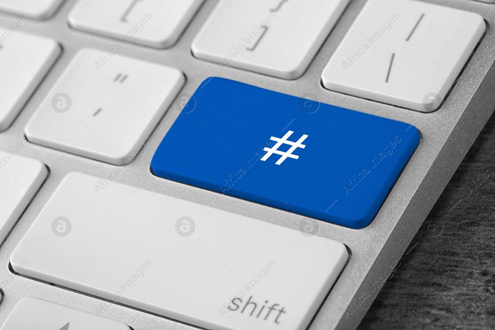 Image of Blue button with hashtag sign on computer keyboard, closeup