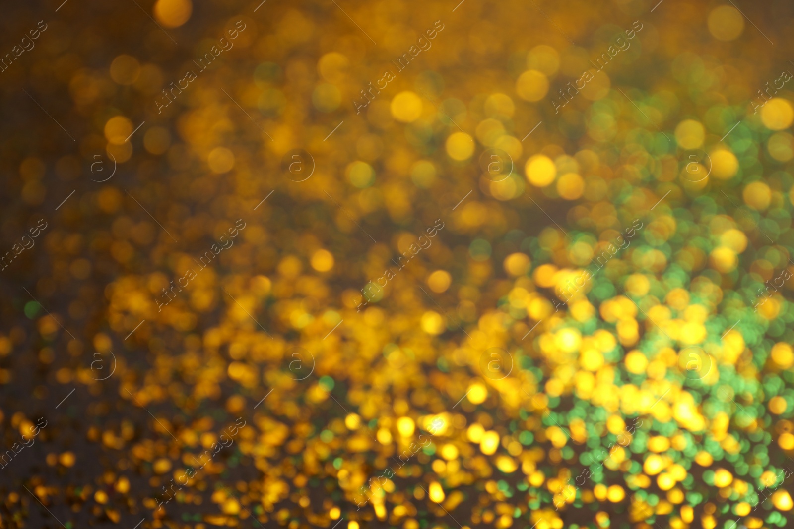 Photo of Blurred view of shiny glitter as background. Bokeh effect