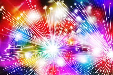 Blurred view of abstract bright colorful background with sparks and bokeh effect 