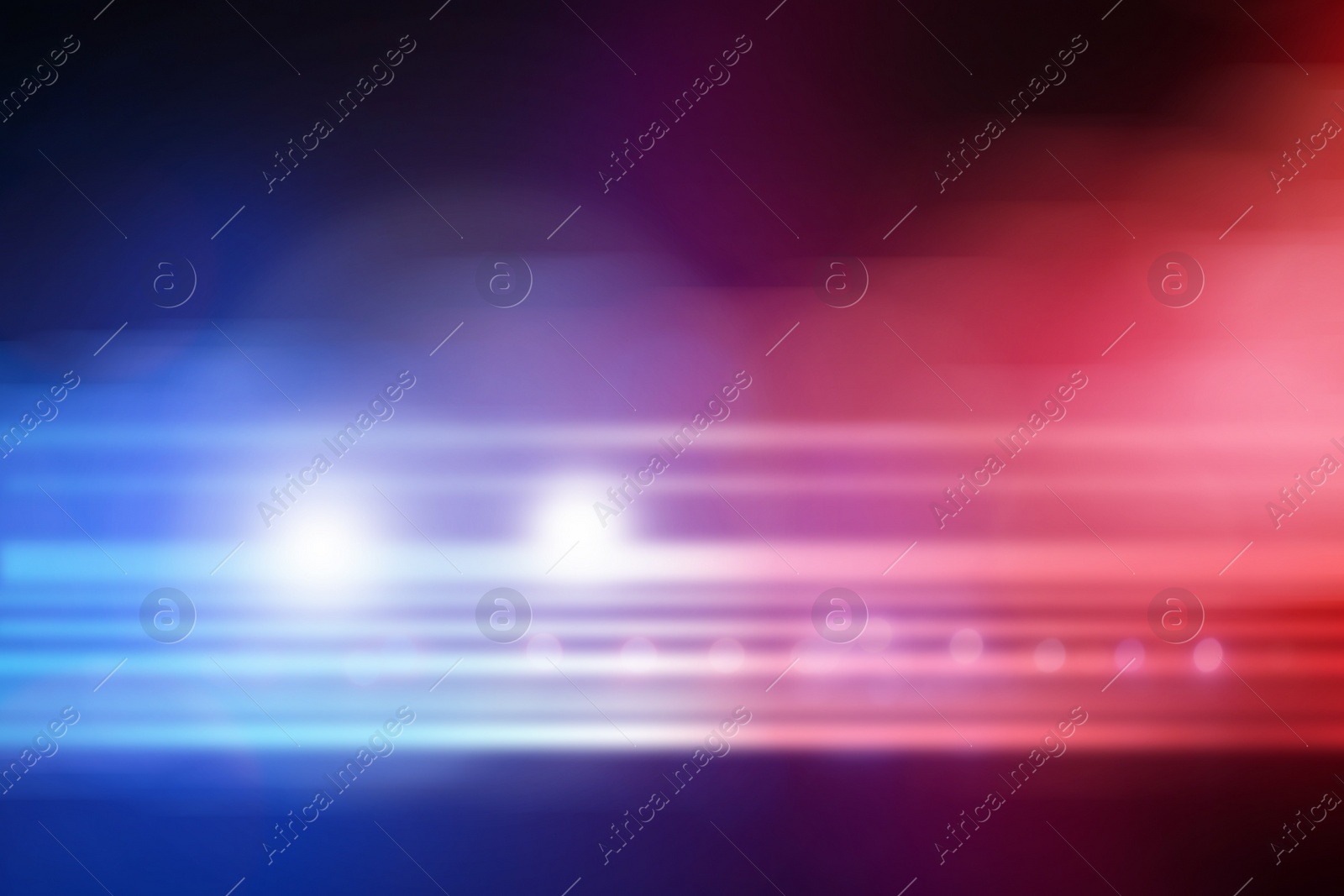 Image of Blurred view of police car on street at night