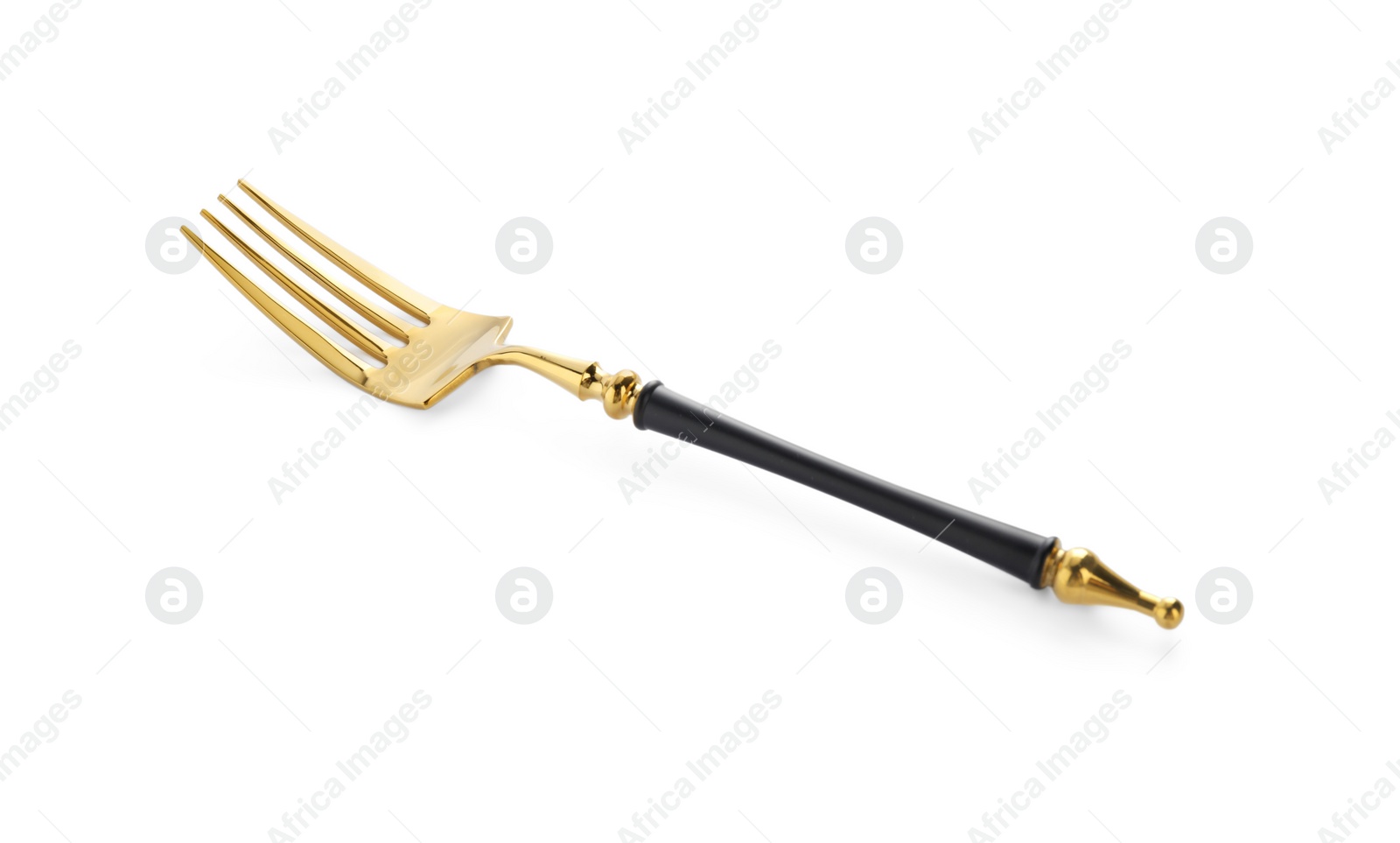 Photo of One shiny golden fork isolated on white