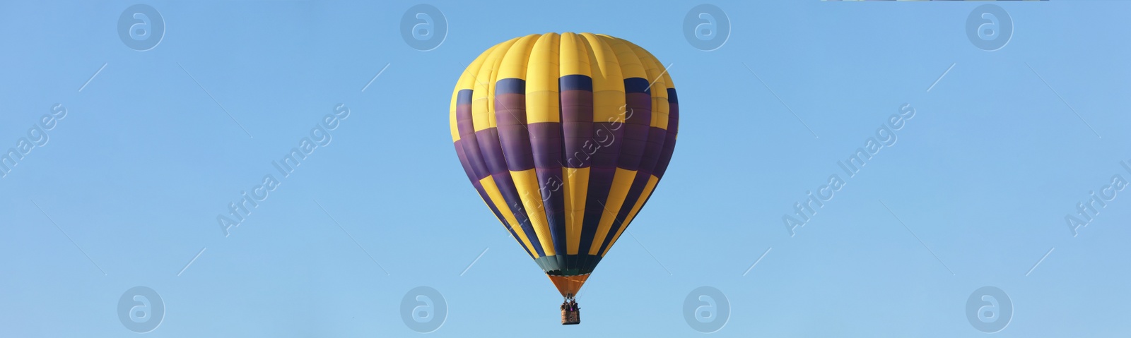 Image of Hot air balloon in blue sky. Banner design 
