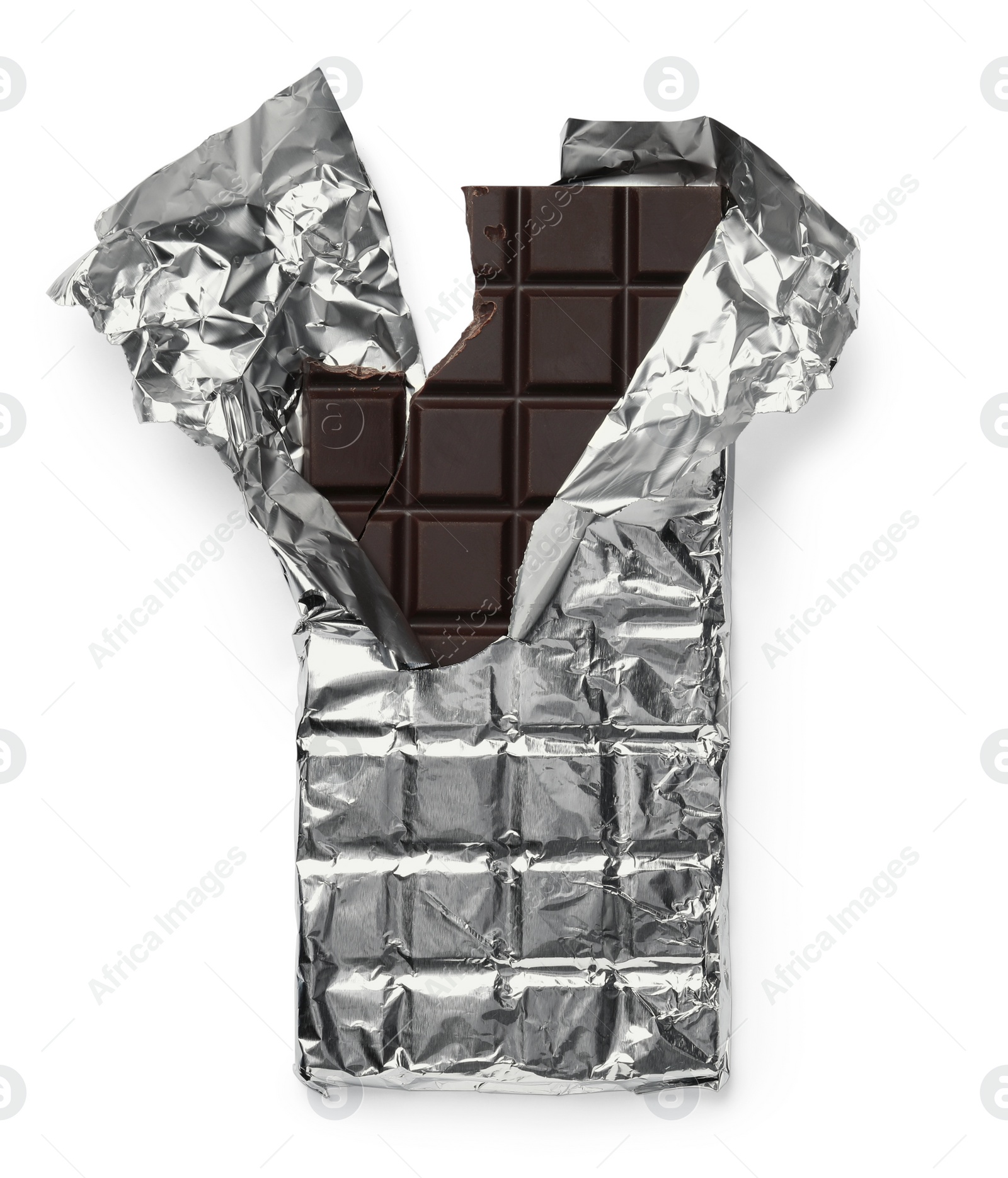 Photo of Broken dark chocolate bar wrapped in foil isolated on white, top view
