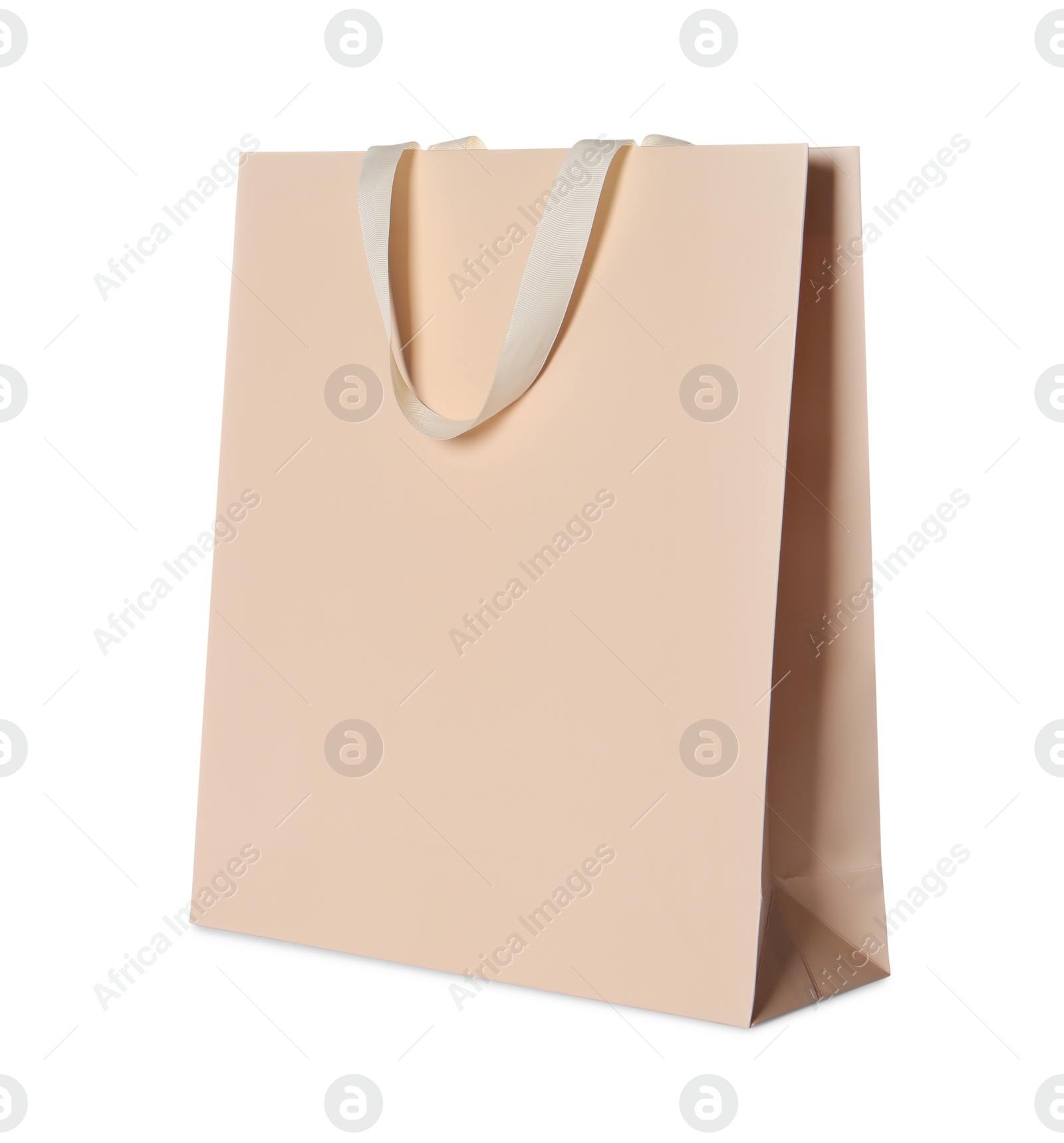 Photo of One beige shopping bag isolated on white