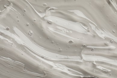 Photo of Clear cosmetic gel on grey background, top view