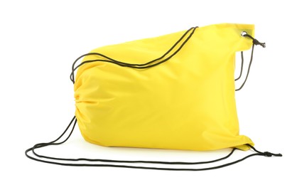 Photo of One yellow drawstring bag isolated on white