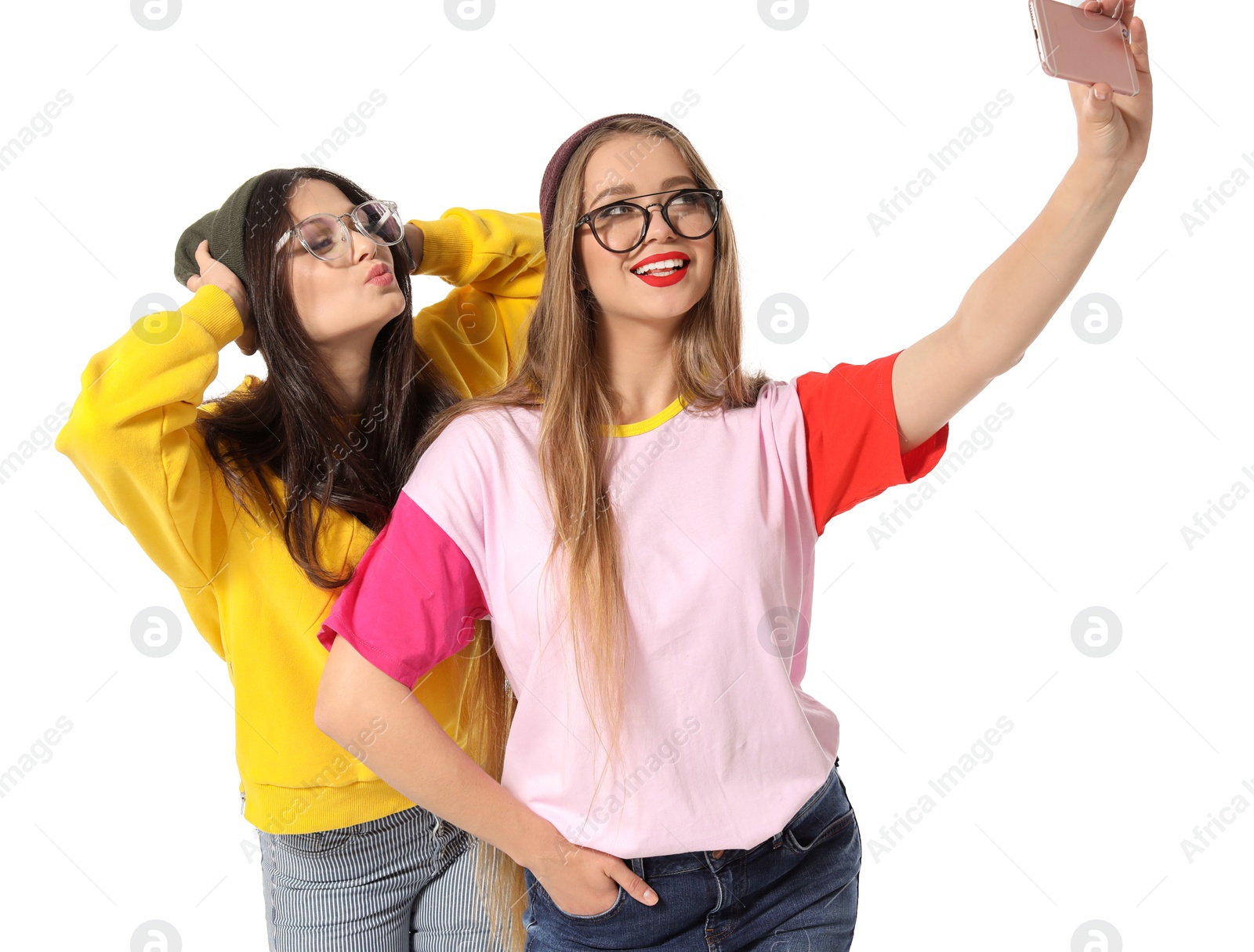 Photo of Attractive young women taking selfie on white background