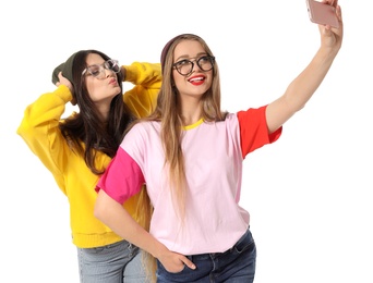 Photo of Attractive young women taking selfie on white background
