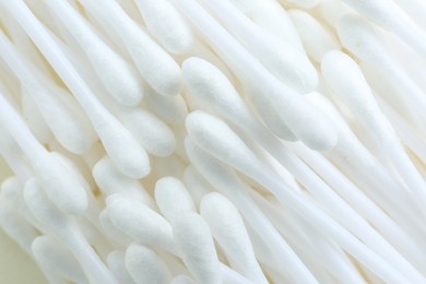 Photo of Many cotton buds as background, closeup view