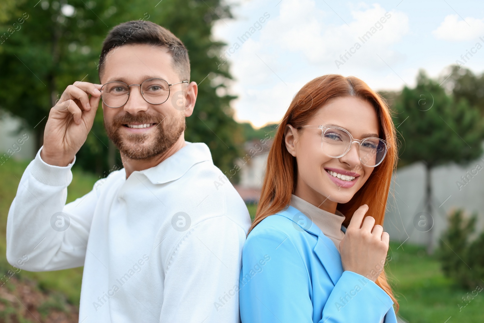 Photo of Portrait of happy couple in glasses outdoors