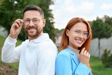 Portrait of happy couple in glasses outdoors