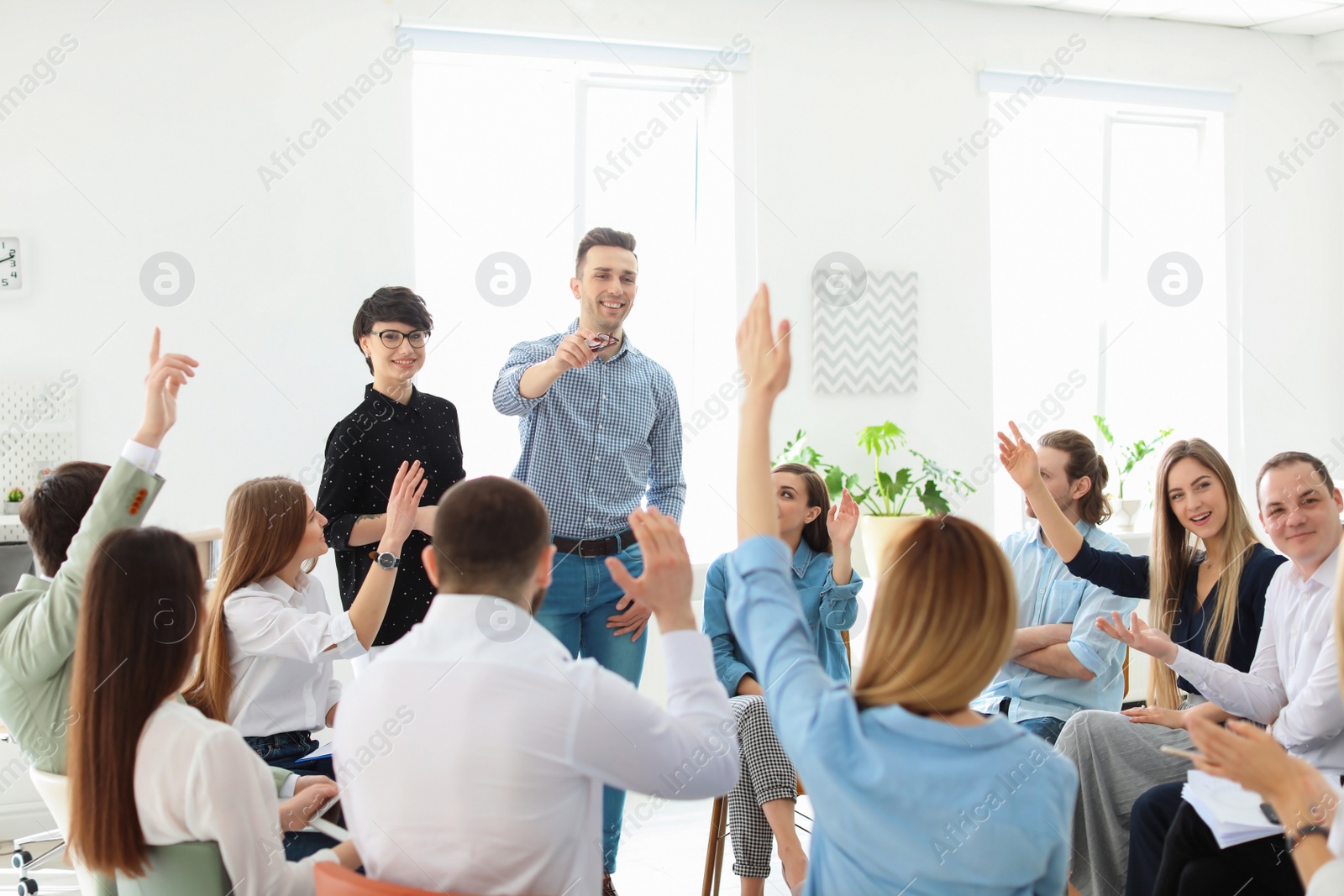 Photo of Young people having business training in office