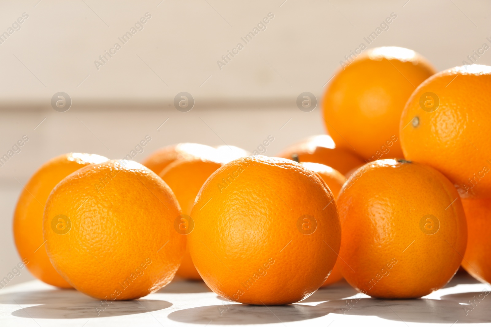 Photo of Fresh juicy oranges on table, closeup. Healthy fruits