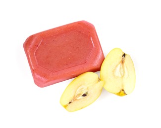 Photo of Delicious sweet quince paste and fresh cut fruit isolated on white, top view