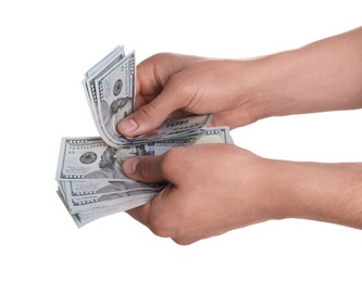 Photo of Money exchange. Man holding dollar banknotes on white background, closeup