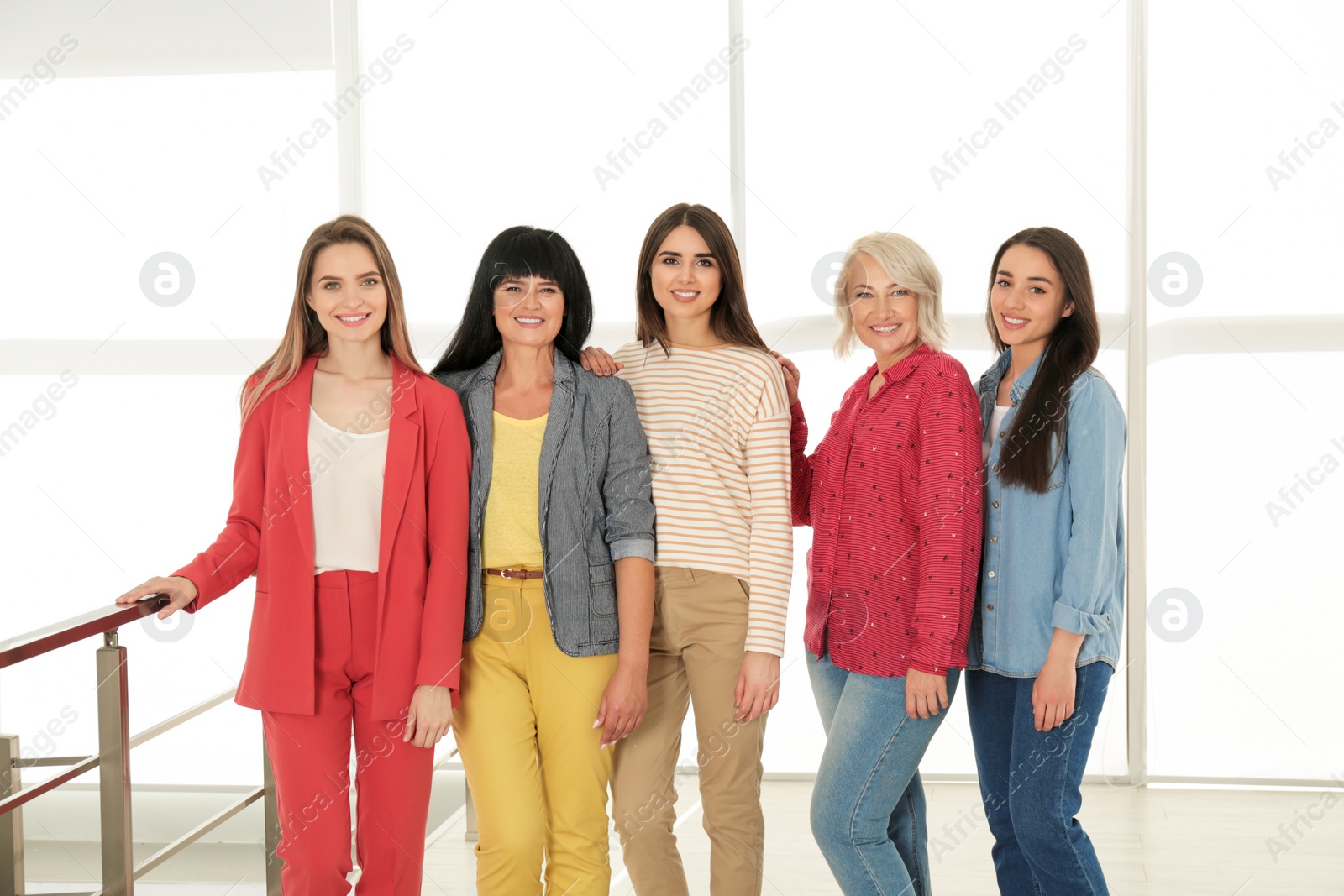 Photo of Group of ladies near window indoors. Women power concept