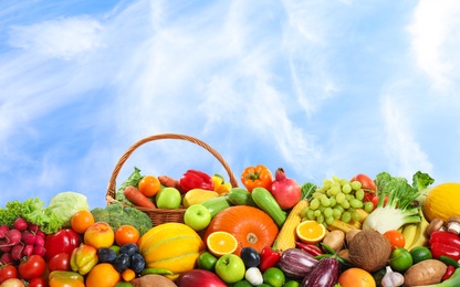Image of Assortment of fresh organic fruits and vegetables outdoors 