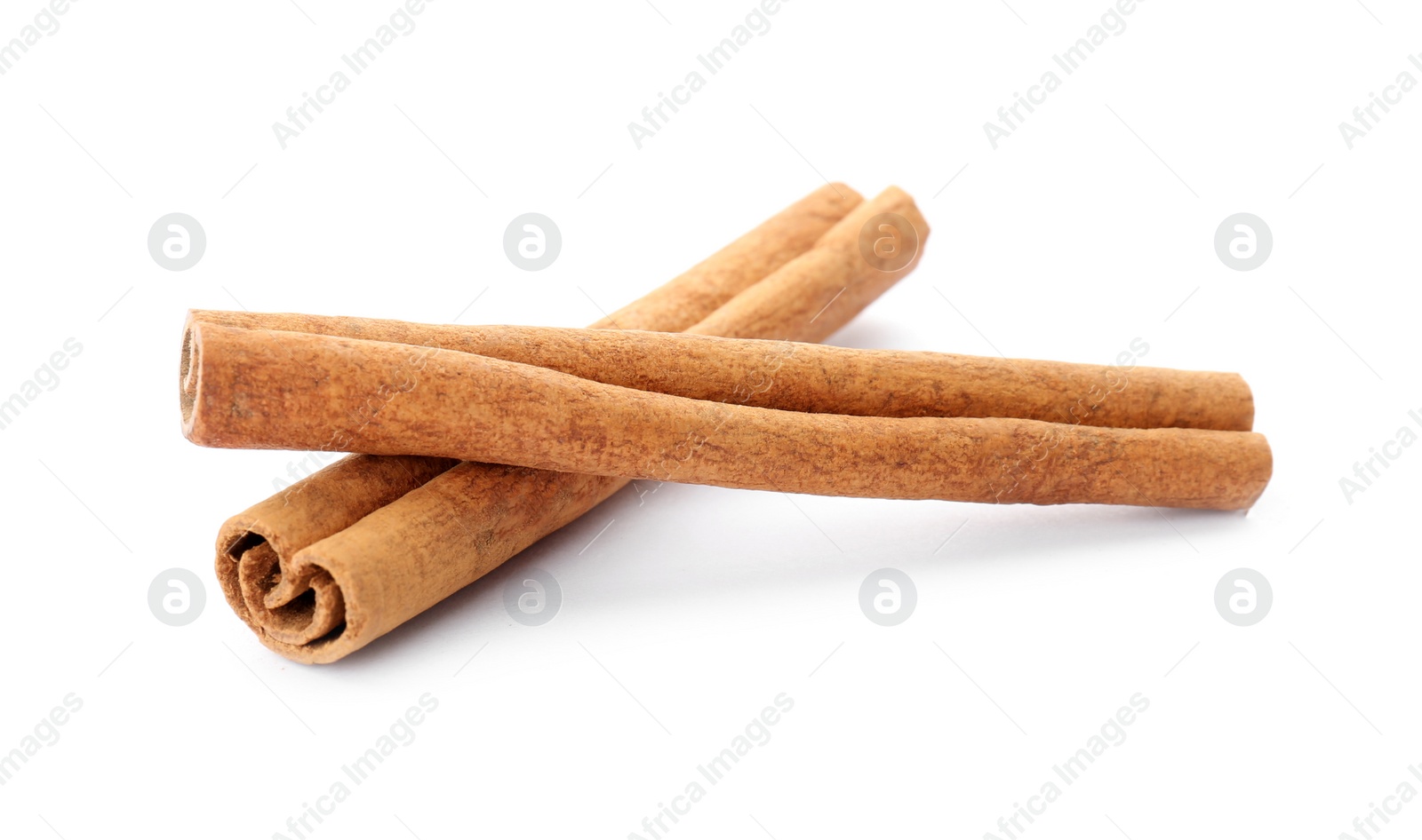 Photo of Aromatic cinnamon sticks on white background