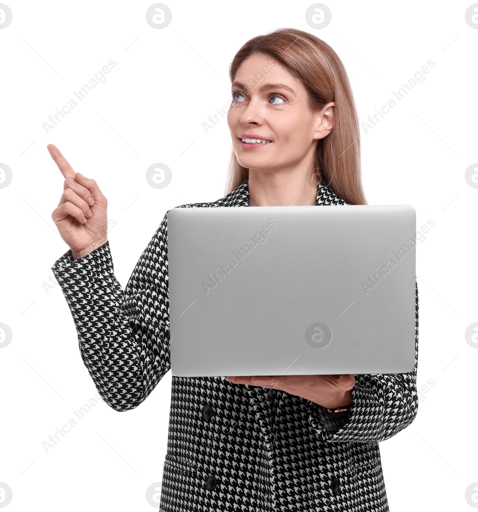 Photo of Beautiful happy businesswoman with laptop pointing at something on white background