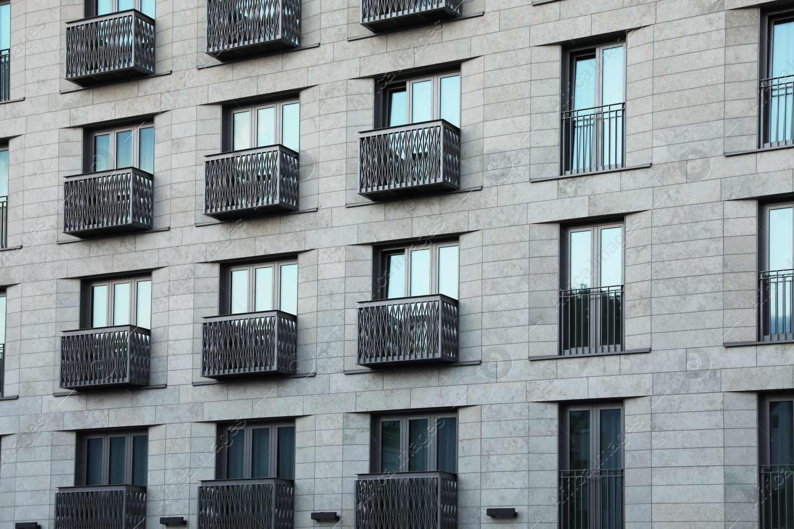 Photo of Beautiful view of modern building with big windows outdoors