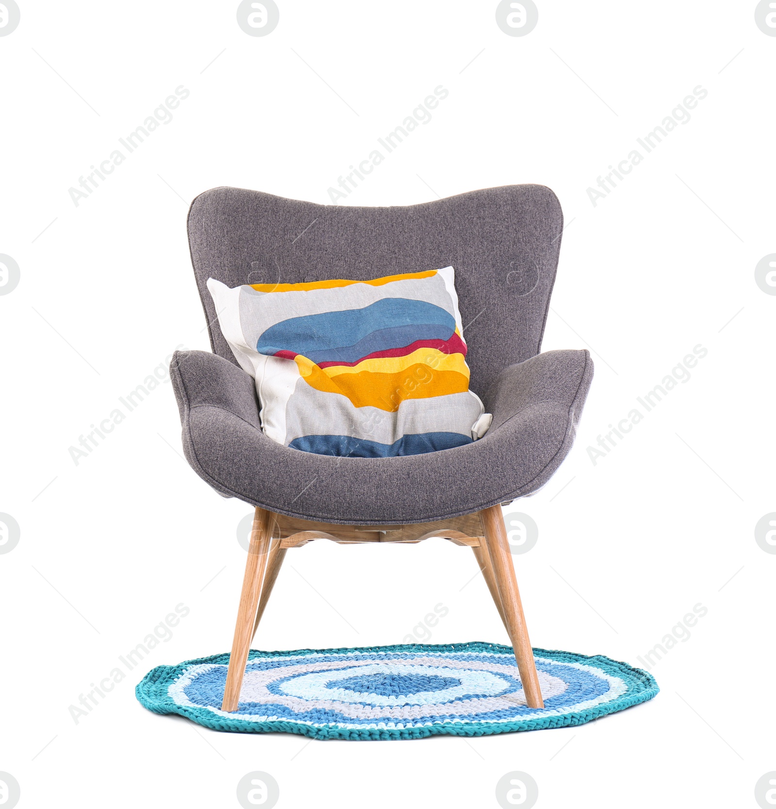 Photo of Comfortable armchair with pillow on white background. Interior element