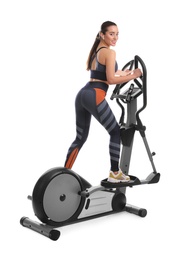 Photo of Woman using modern elliptical machine on white background