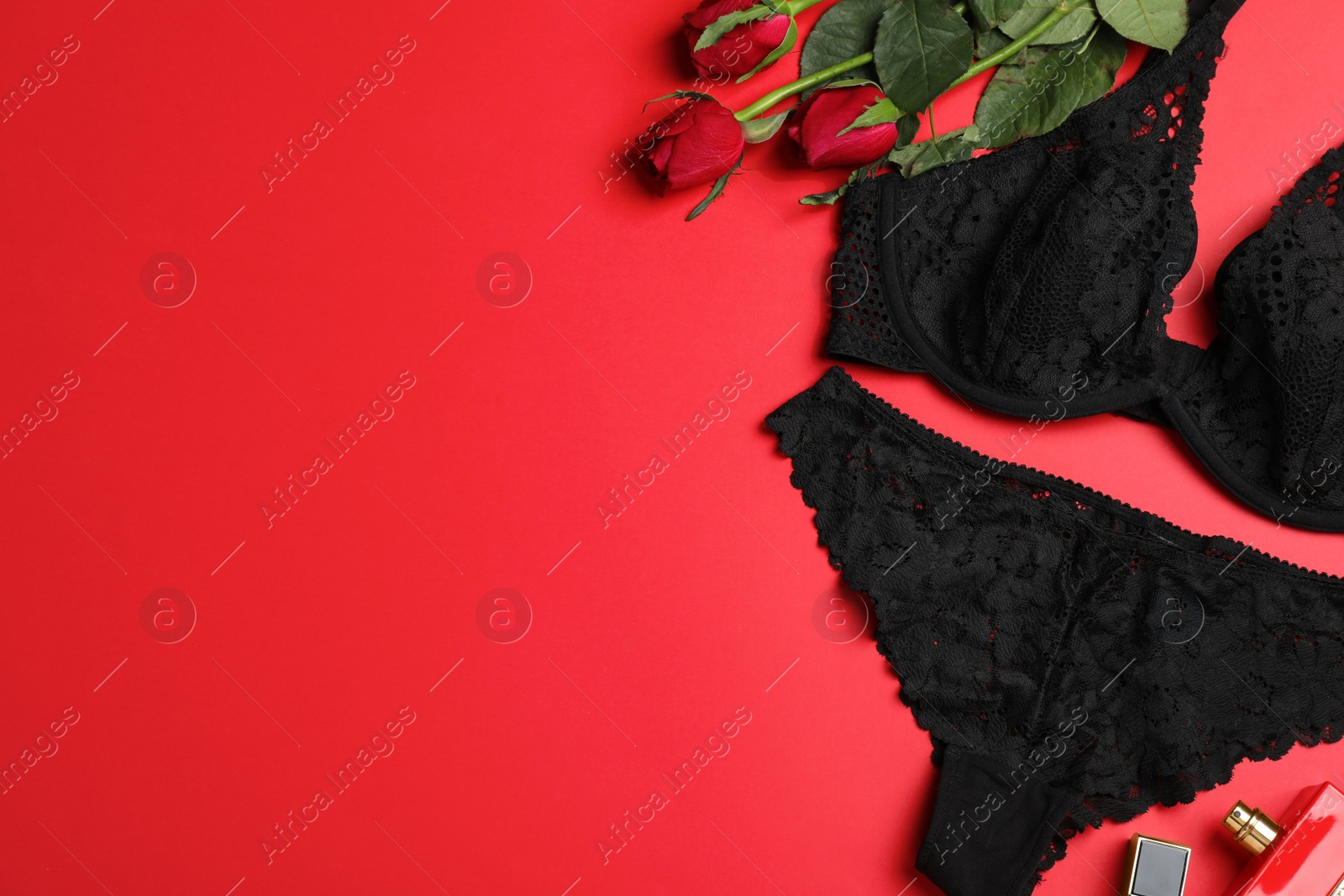 Photo of Flat lay composition with sexy lingerie on red background. Space for text