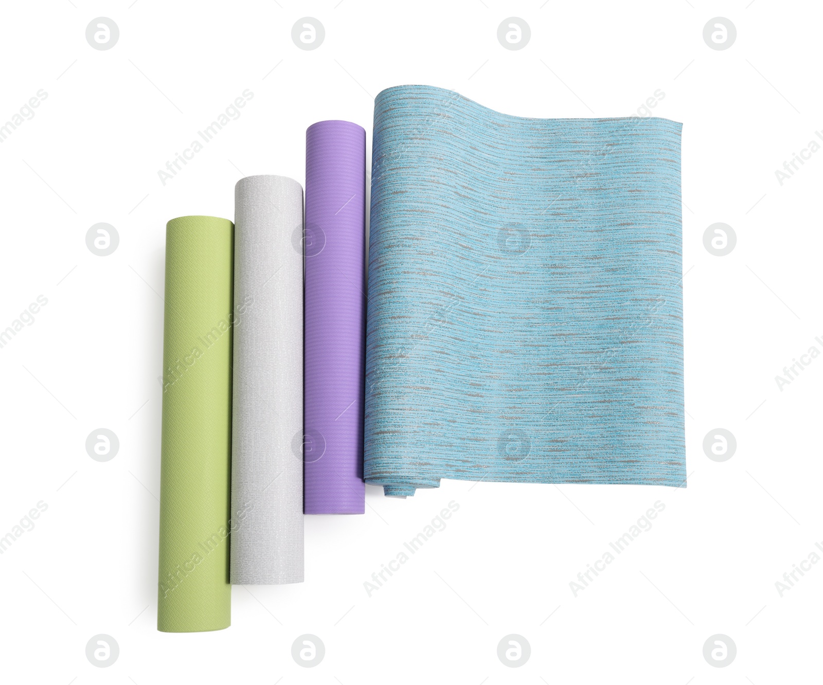 Photo of Different wallpaper rolls isolated on white, top view