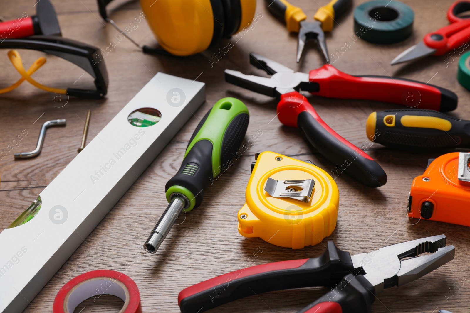 Photo of Different modern construction tools on wooden background