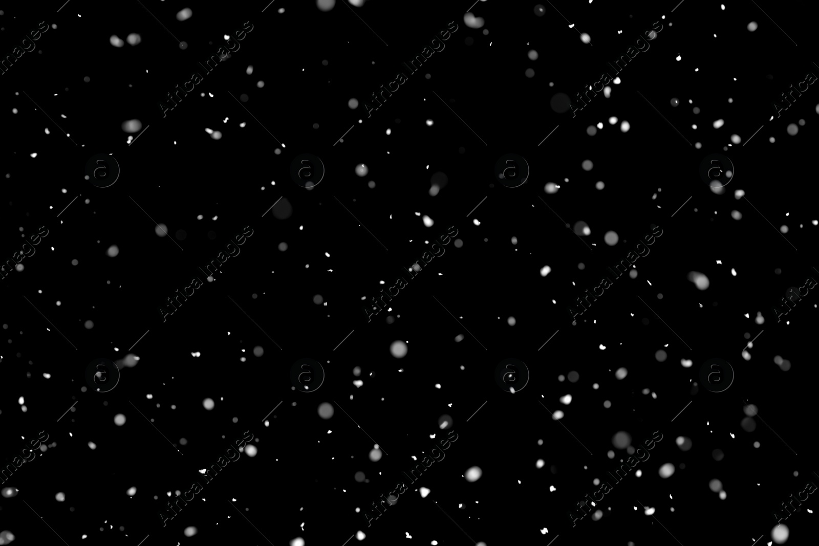 Photo of White snow falling down on black background