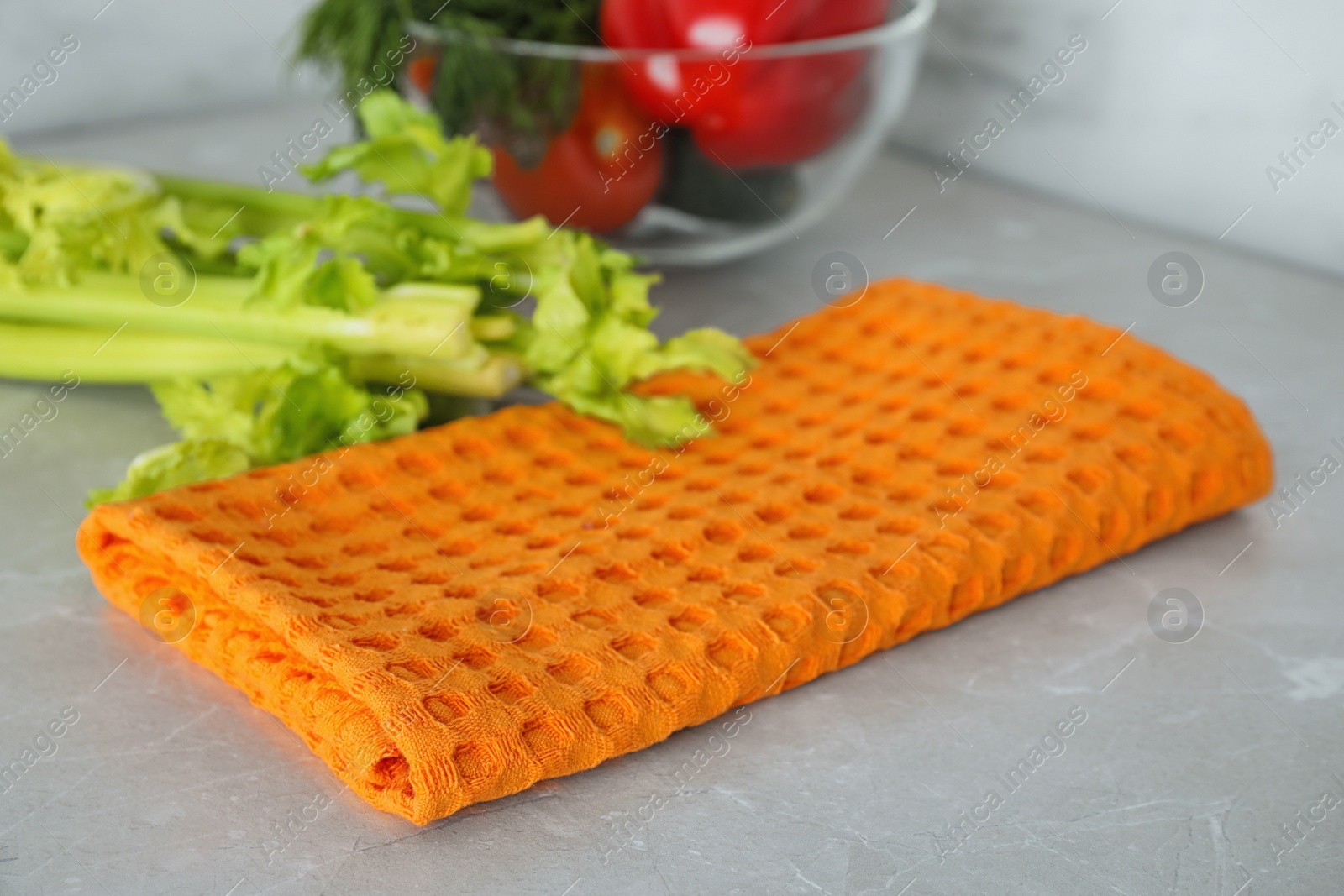 Photo of Fabric kitchen towel on marble table, closeup