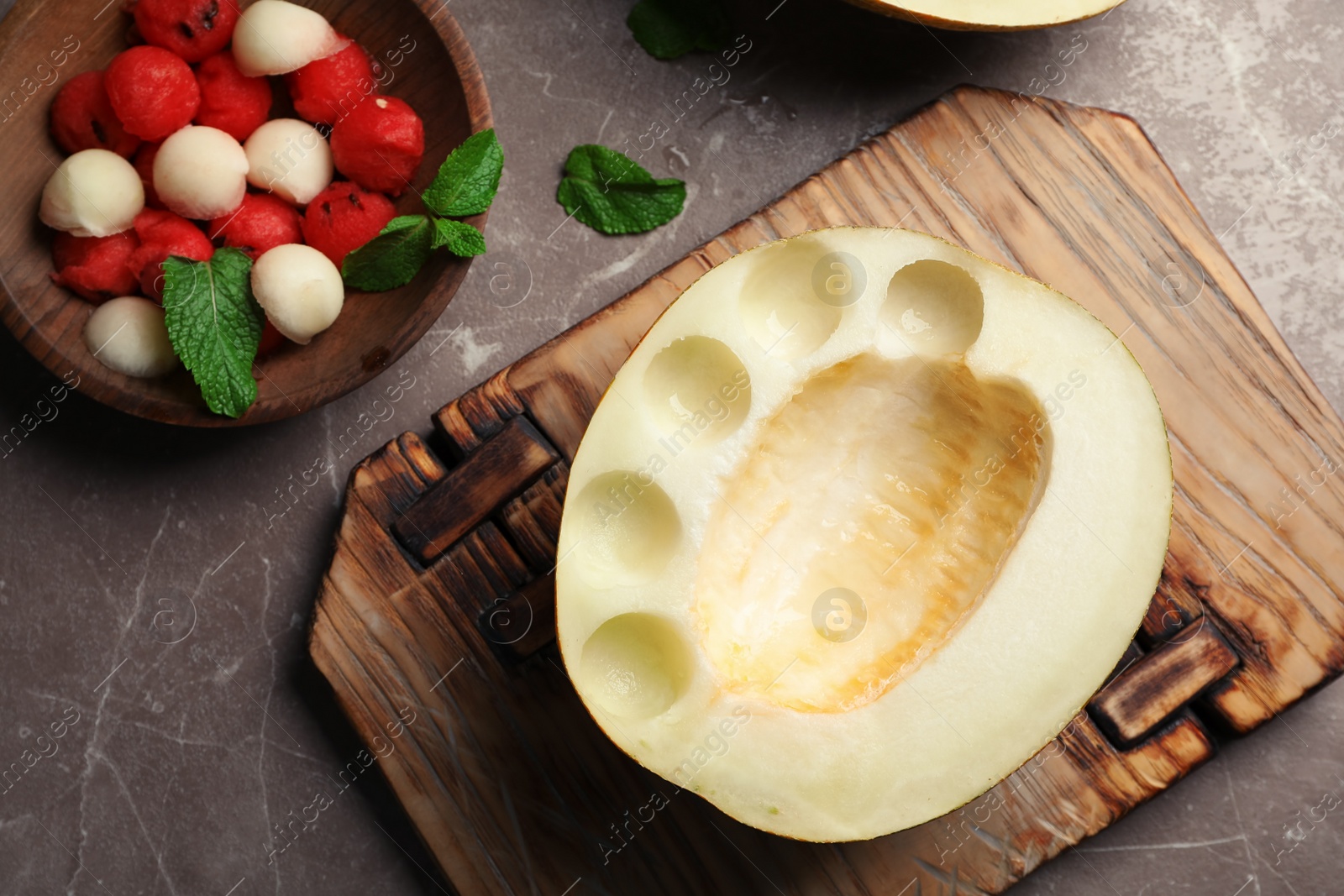 Photo of Flat lay composition with mint, melon and watermelon balls on grey background