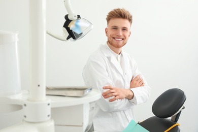 Portrait of professional dentist in modern clinic