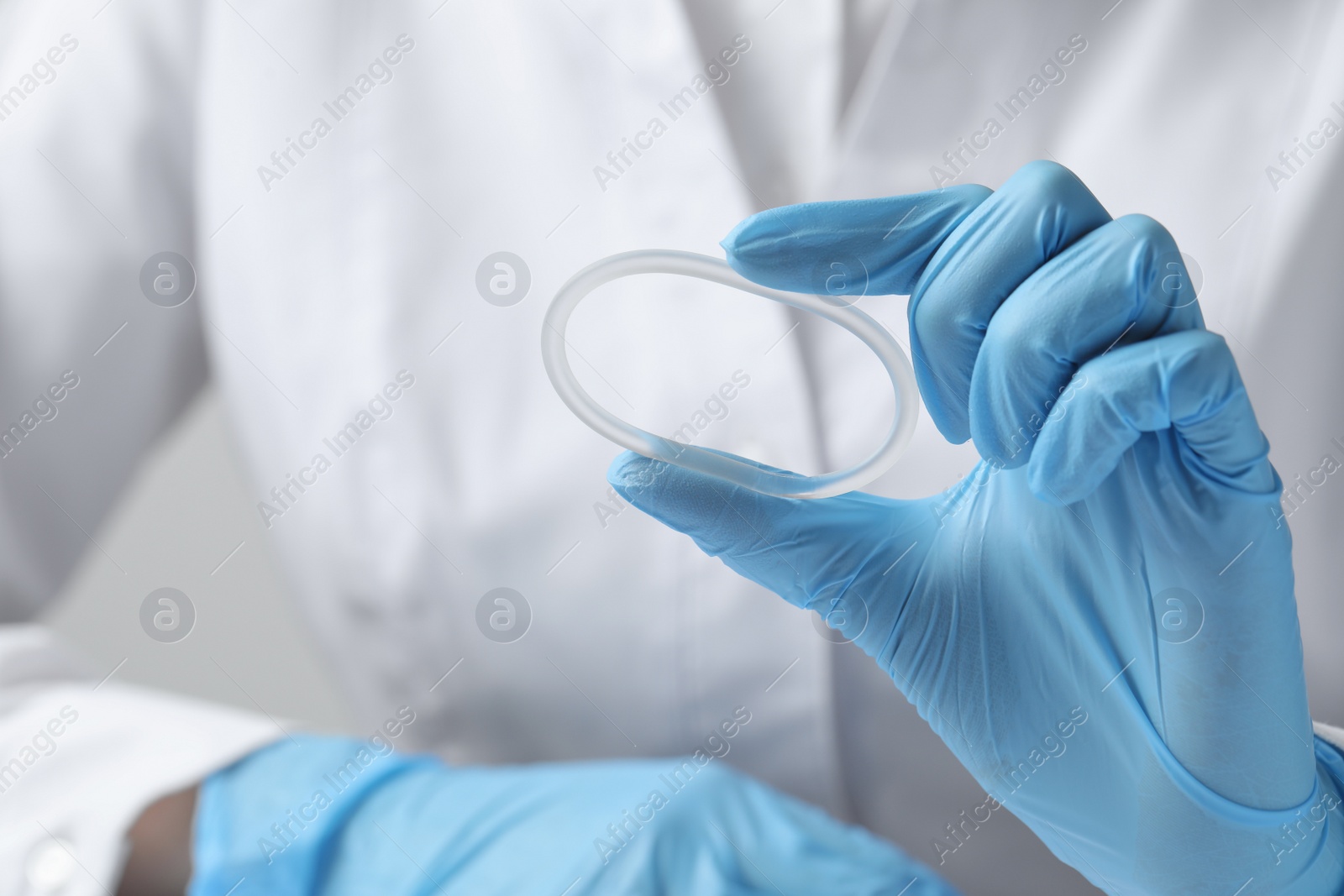 Photo of Doctor holding diaphragm vaginal contraceptive ring, closeup