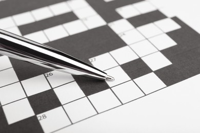 Pen and blank crossword, closeup. Space for text