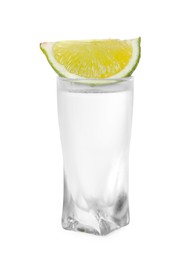 Photo of Glass of vodka with lime isolated on white