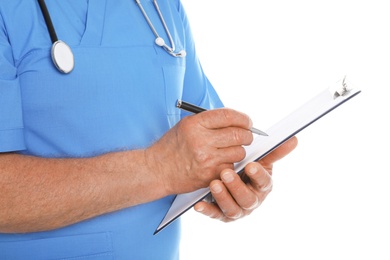 Photo of Male doctor in scrubs with stethoscope and clipboard isolated on white, closeup. Medical staff