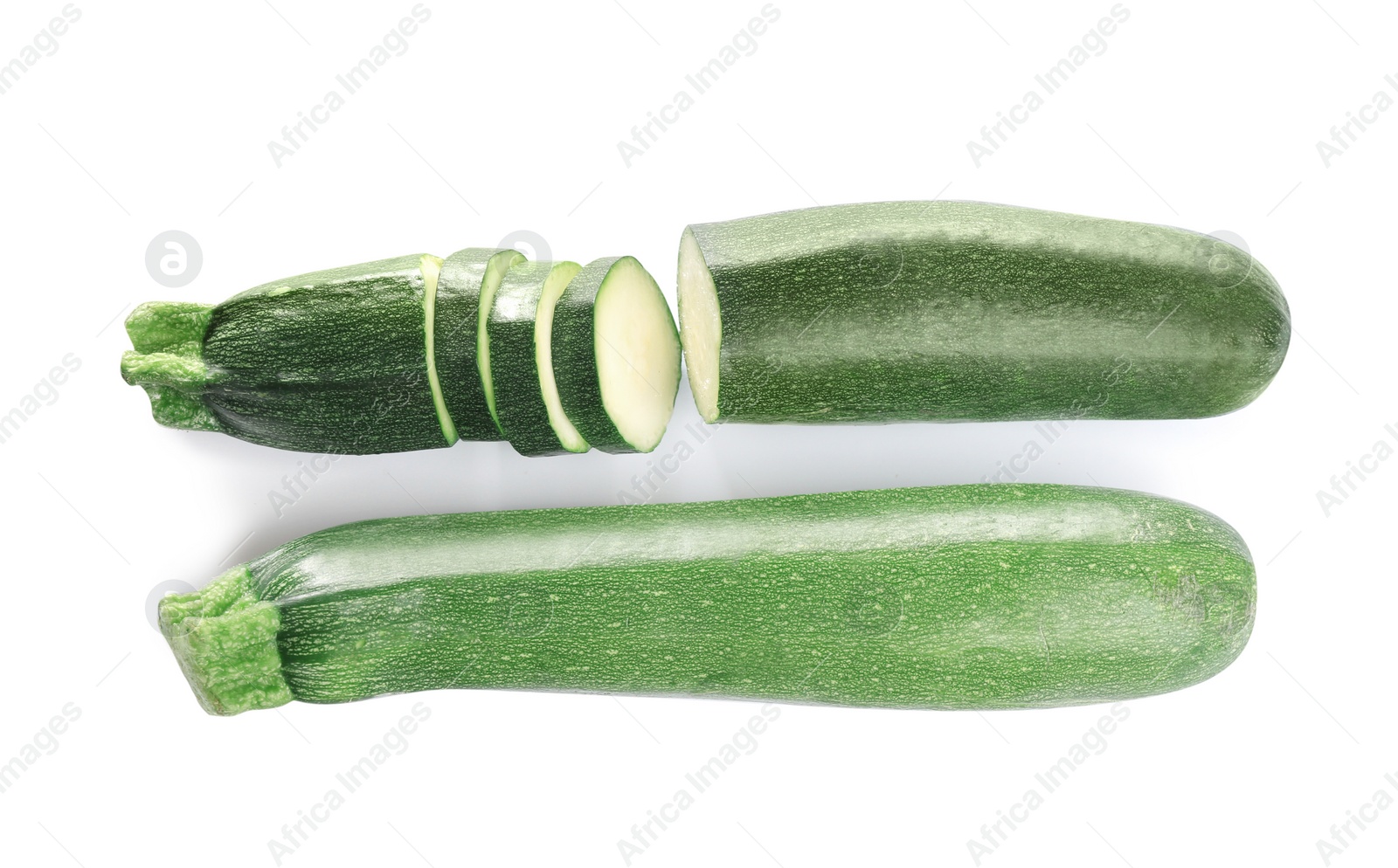 Photo of Fresh ripe green zucchinis isolated on white, top view