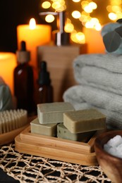 Photo of Beautiful composition with different spa products on table against blurred lights