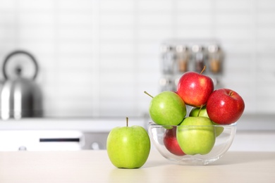 Bowl of fresh apples on kitchen counter. Space for text