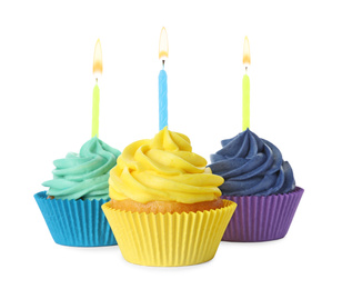 Photo of Delicious birthday cupcakes with candles isolated on white