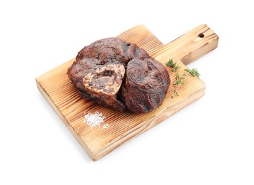 Photo of Piece of delicious grilled beef meat, thyme and salt isolated on white