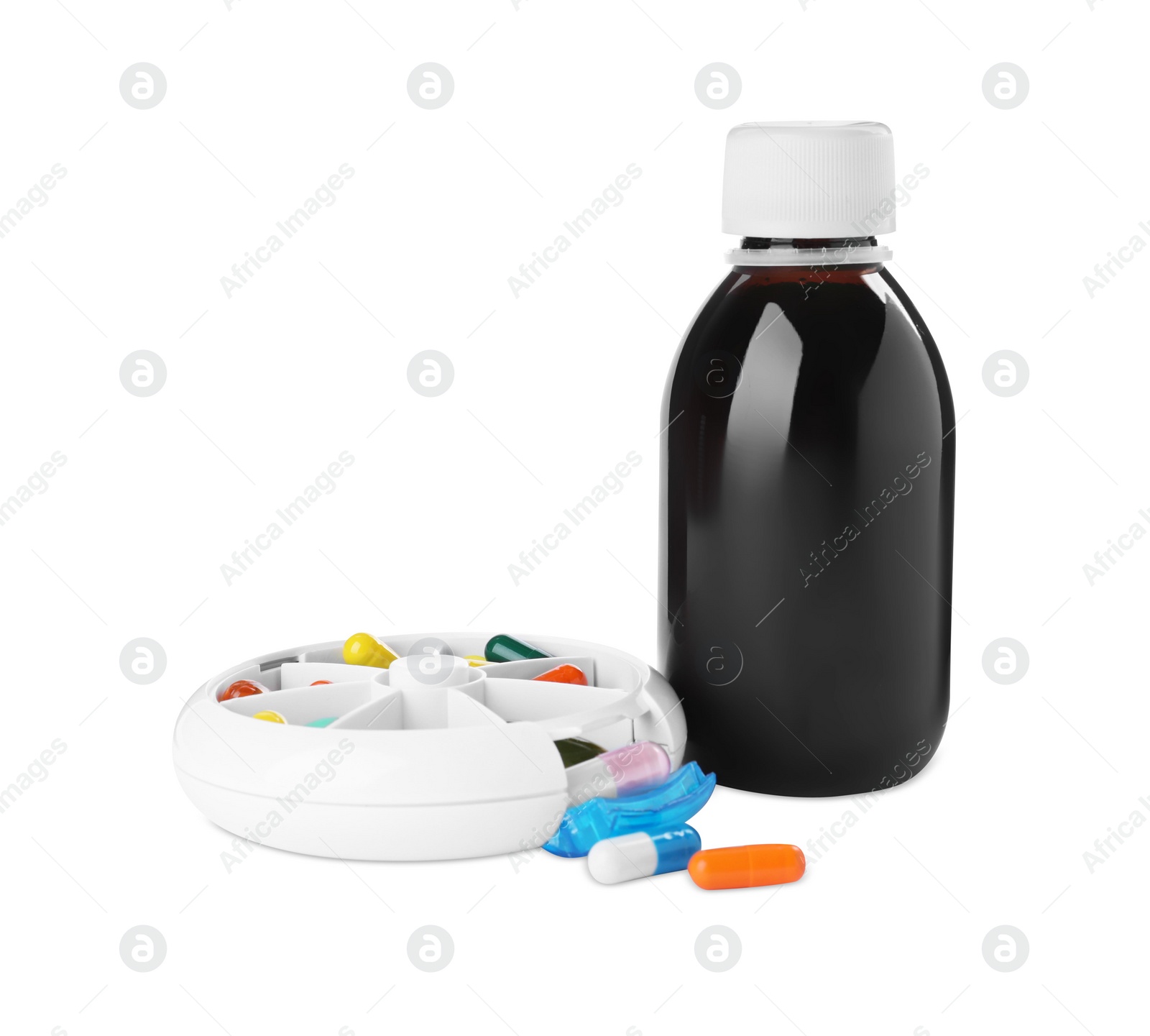 Photo of Bottle of syrup with pills on white background. Cough and cold medicine