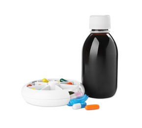 Bottle of syrup with pills on white background. Cough and cold medicine