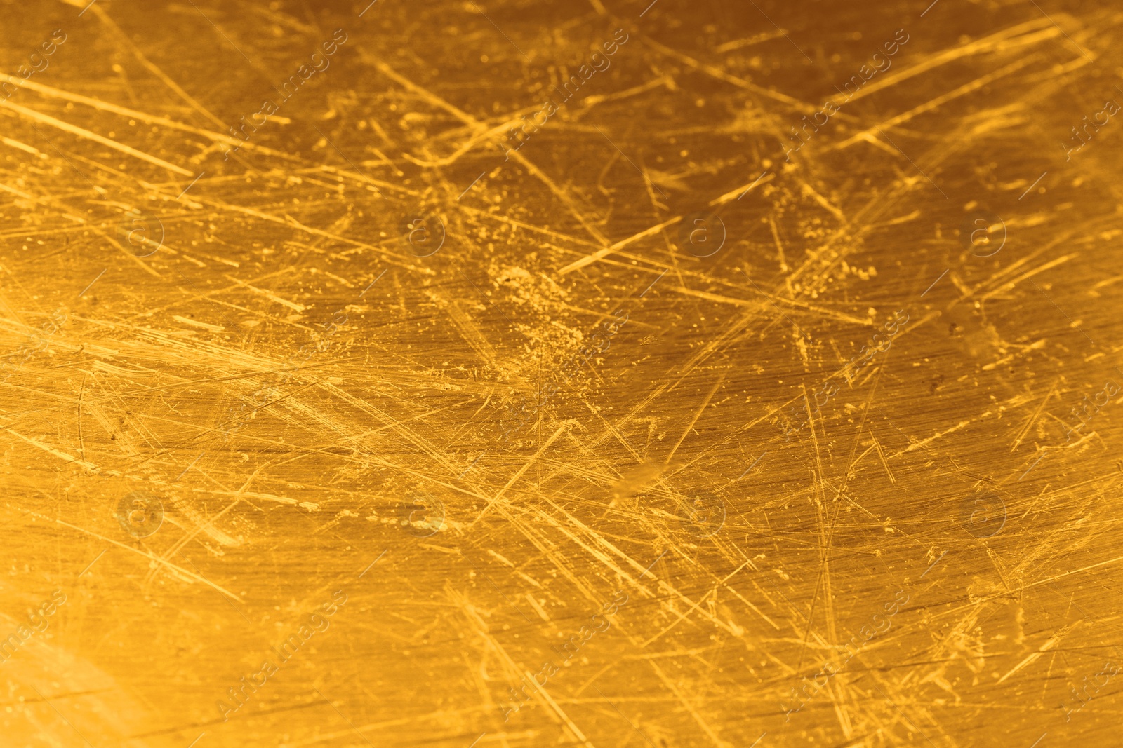 Image of Golden textured surface as background, closeup view