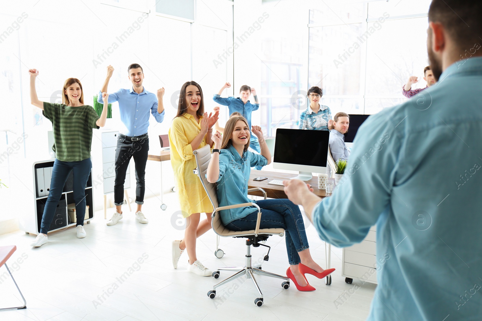 Photo of Young people having business training in office